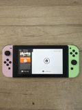 Console Nintendo Switch avec Joy-Con néon rose et néon vert — photo 1