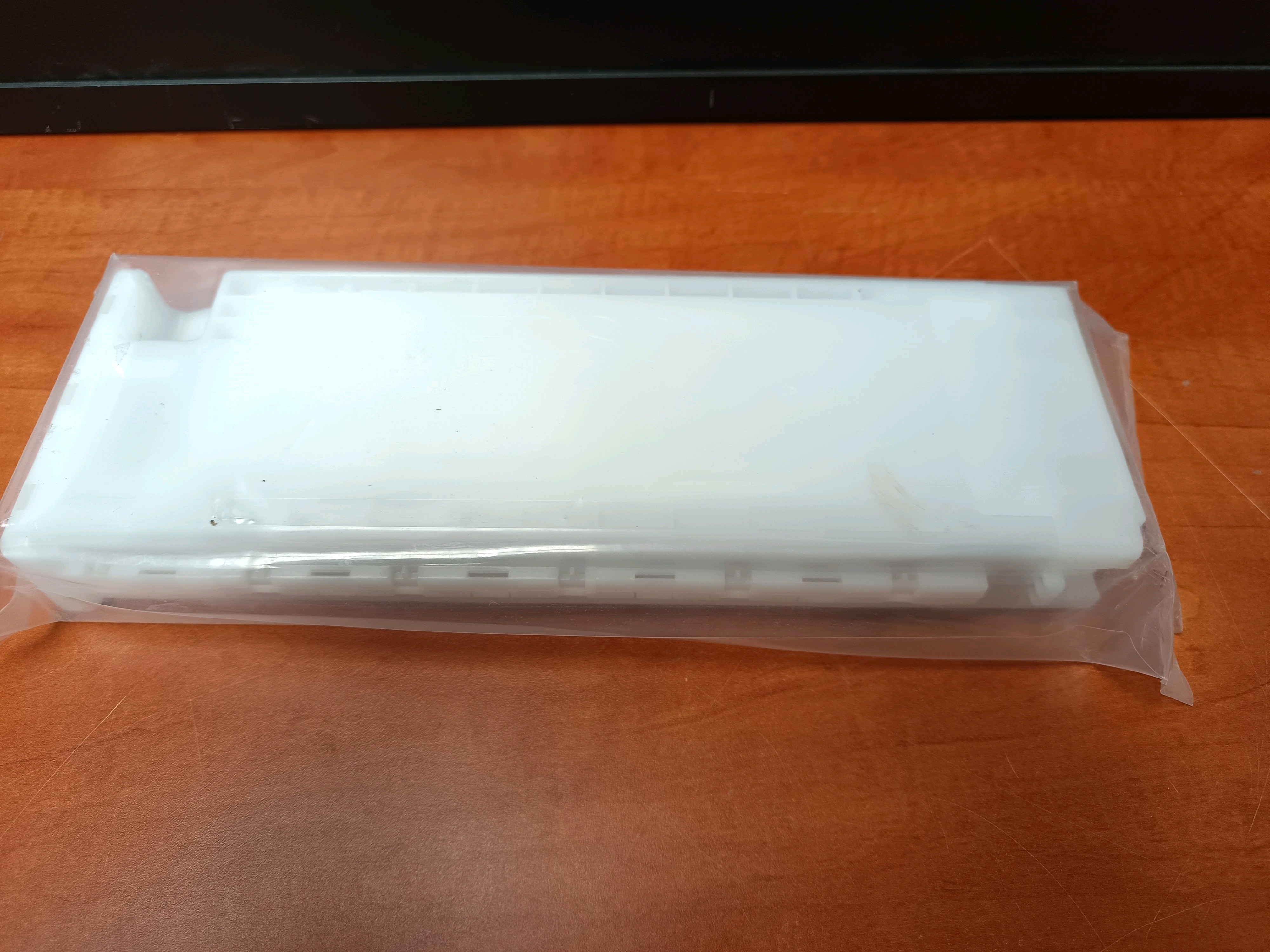 Epson – Pièce détachée d’imprimante (module plastique blanc sous sachet)