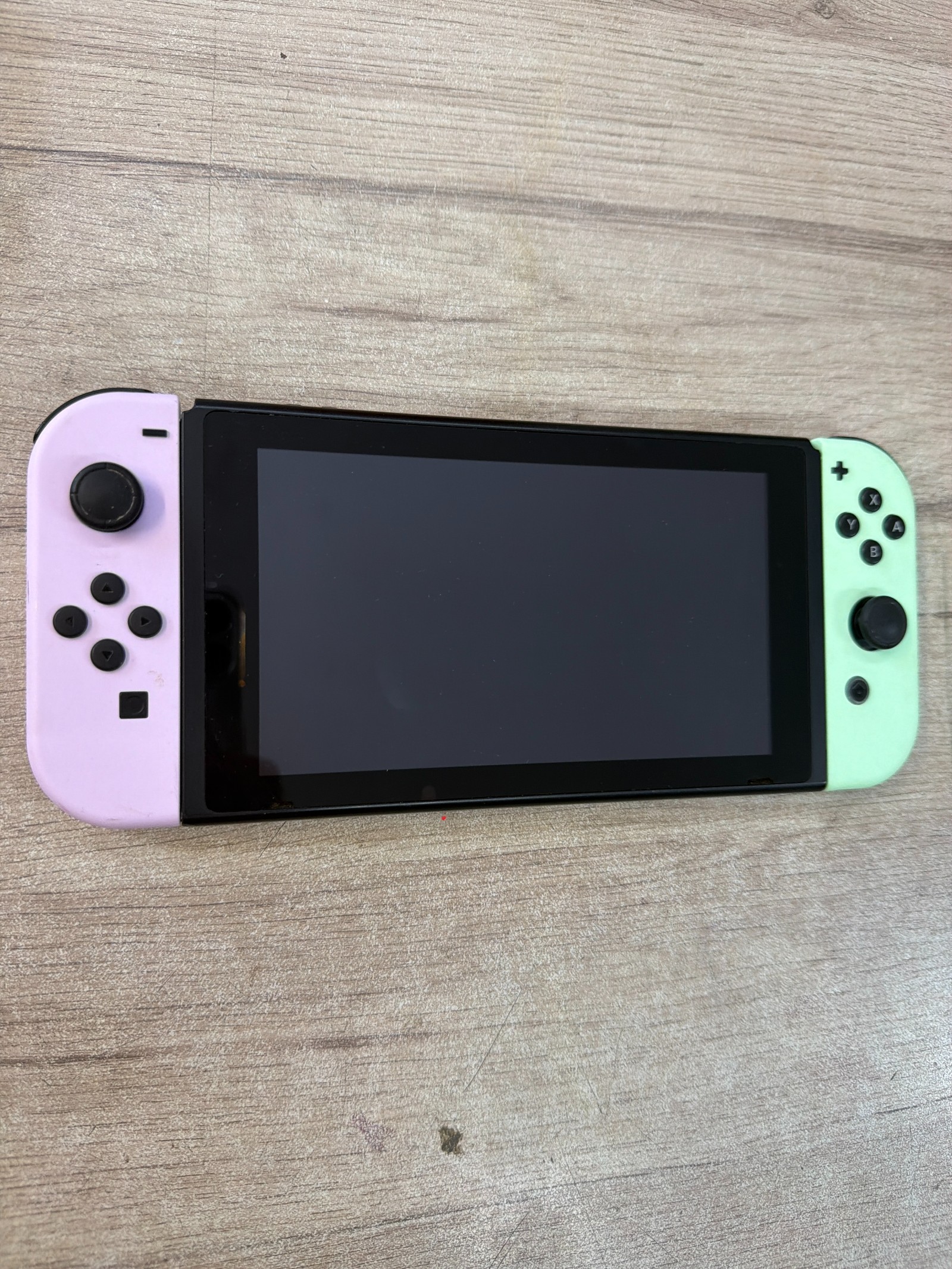 Console Nintendo Switch avec Joy-Con néon rose et néon vert — photo 2