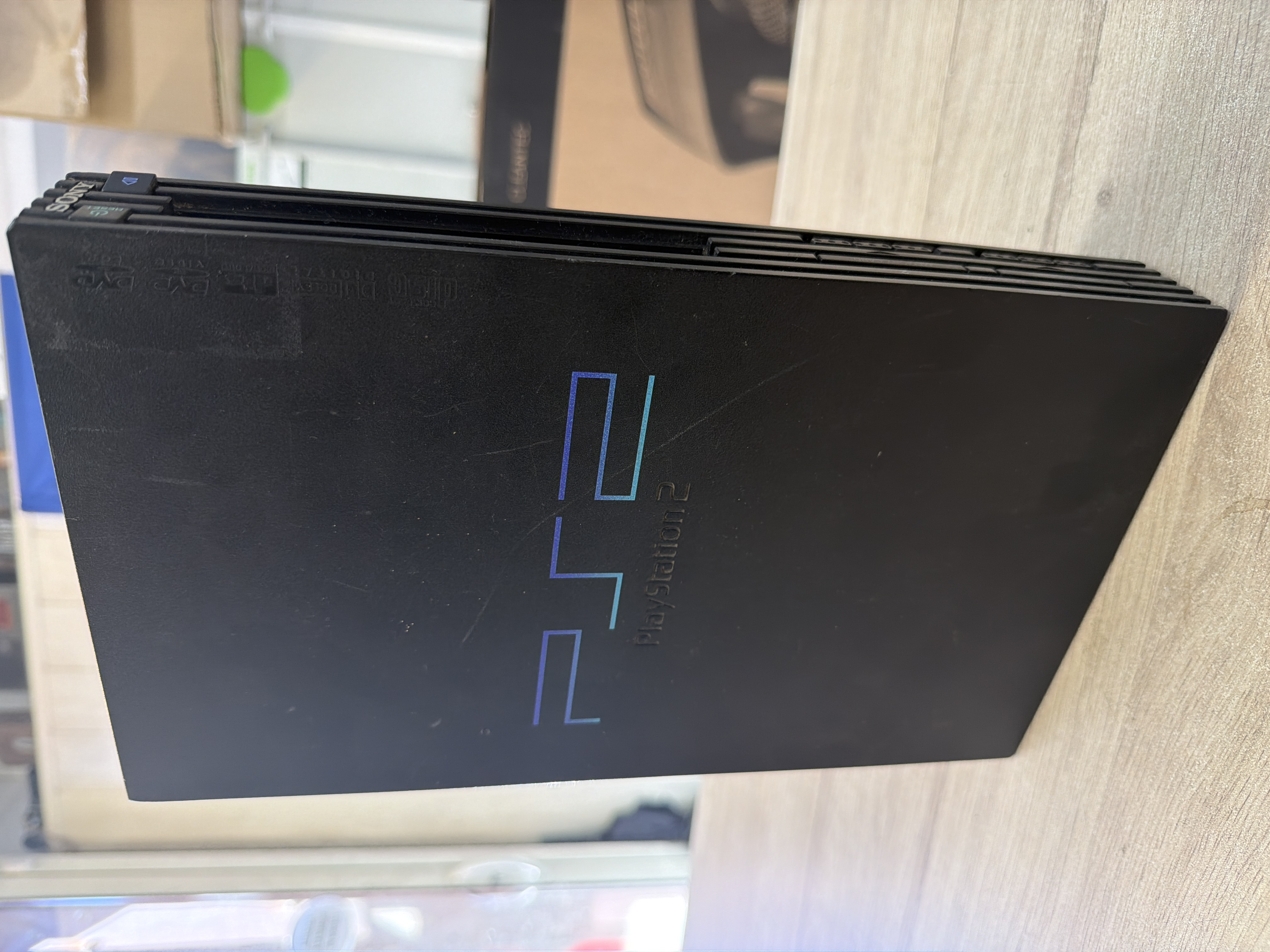 Console Sony PlayStation 2 Slim noire avec manette et câbles