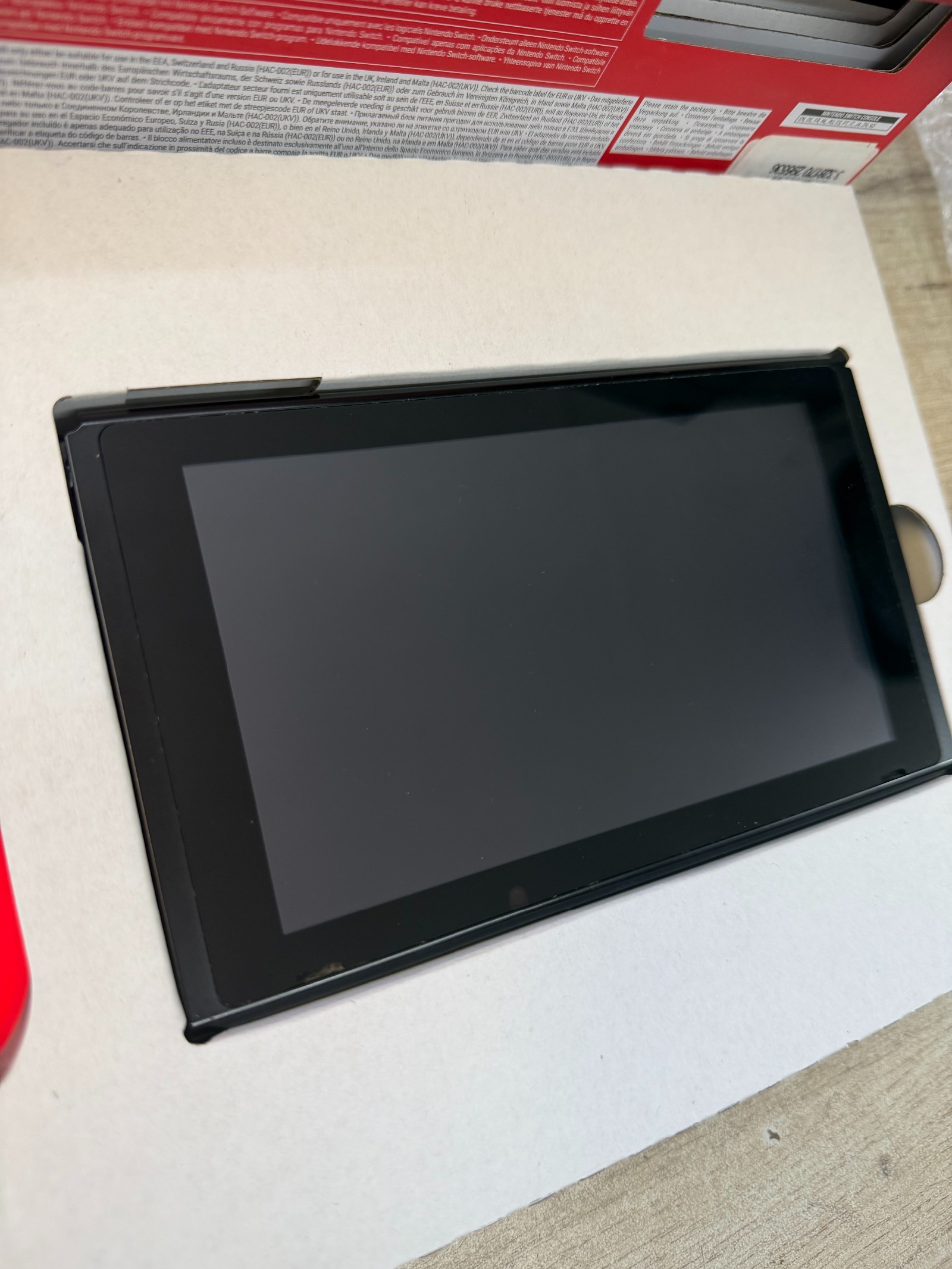 Nintendo Switch (Joy-Con Néon Rouge/Bleu) + dock — complet en boîte — photo 2