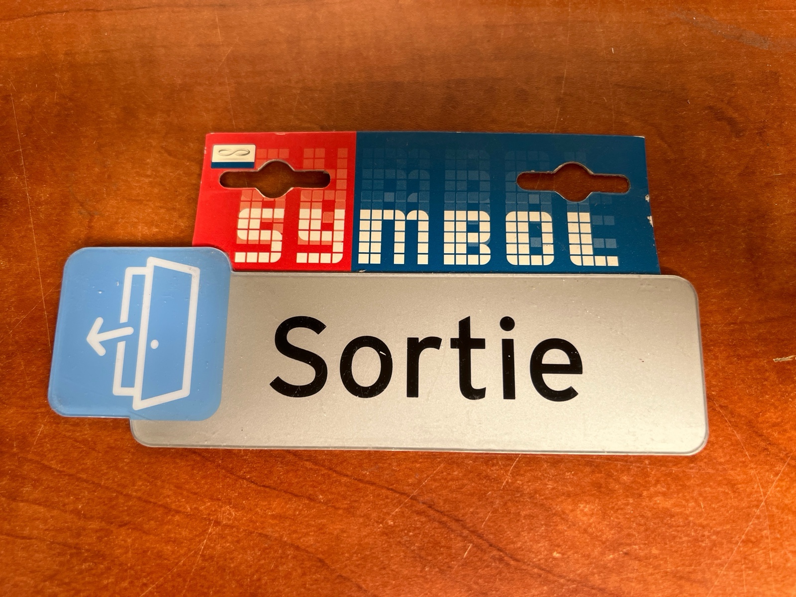 Plaque de porte Symbol « Sortie »